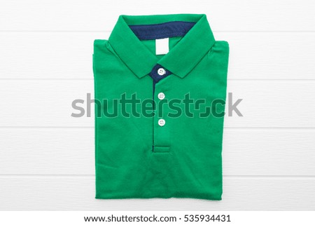 Shirt and Clothes on white wooden background