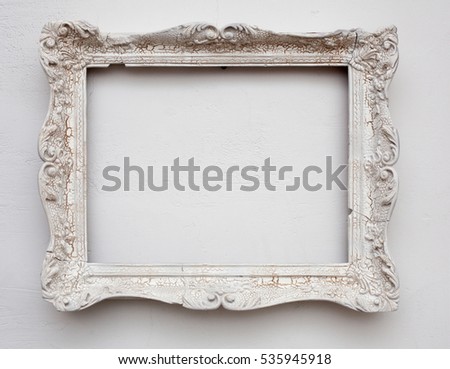Vintage antique white frame on the white wall