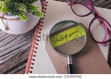 Business Concept : EXECUTIVE SEARCH written on envelope with wooden background