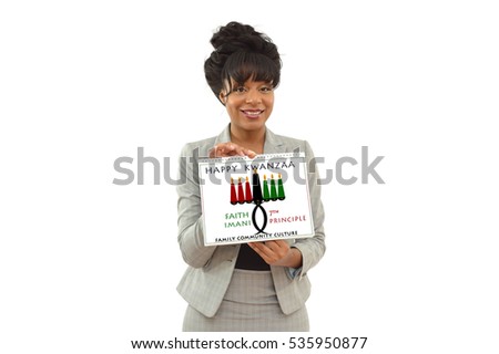 Happy Kwanzaa Faith (Imani) Calendar Seventh Principle Kinara Candle holder held by African American Business Woman looking at camera smiling isolated on white background