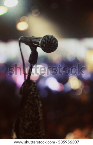 Close up microphone on the stand bokeh background.