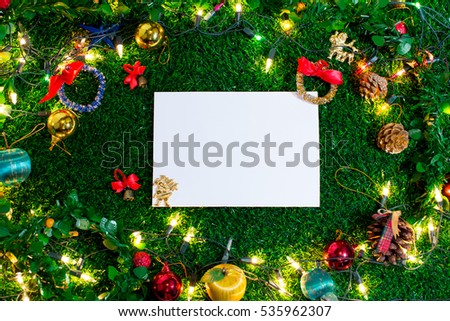 Christmas day on green grass and copy space. Morning sunshine day and good day.Happy time together in winter season.Textures background top view.
