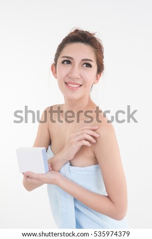 portrait of asia woman  in towel showing blank box posing on white background, beauty and healthy skin concept