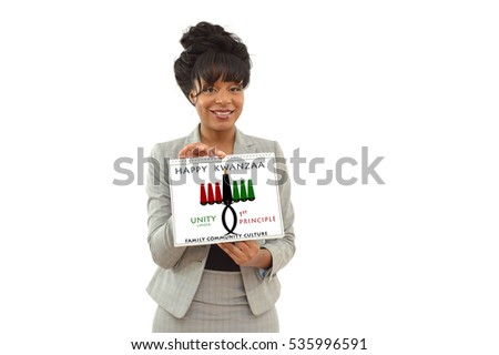 Happy Kwanzaa Unity (Umoja) Calendar Seventh Principle Kinara Candle holder 
held by African American Business Woman looking at camera smiling isolated 
on white background