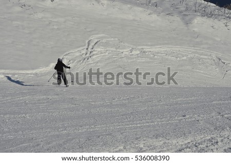 Skier in downhill slope
