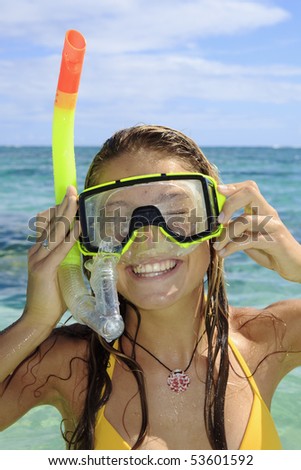 teenage girl in the ocean with mask and snorkel