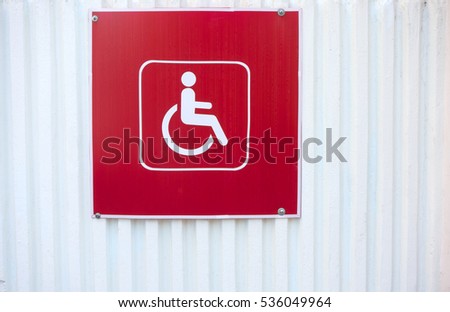 Close up of handicapped reserved parking space with wheelchair symbol on asphalt. 