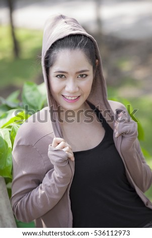 Outdoor portrait of a beautiful teenage asian girl