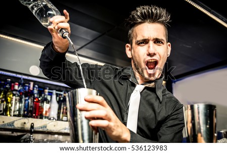 Flair bartender in action Royalty-Free Stock Photo #536123983