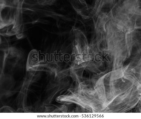 Abstract smoke Weipa. Personal vaporizers fragrant steam. The concept of alternative non-nicotine smoking. White smoke on a black background. Evaporator. Taking Close-up. Vaping.