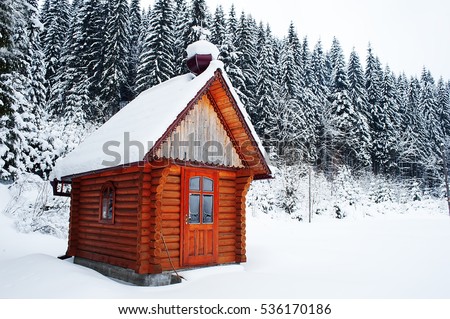 rural wooden building on mountain top at ski resort. vintage picture. winter wallpaper