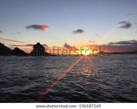Sunset sailing between La Graciosa Island and Lanzarote (Canary Islands, Spain)