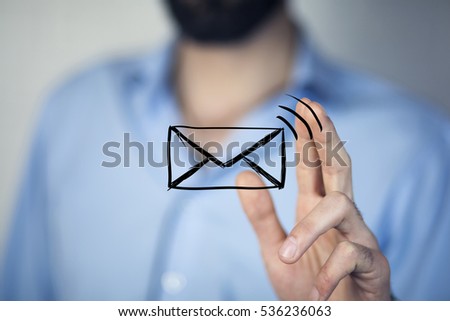 man holds a virtual postal envelope, concept of email, internet and networking