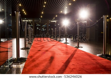 Long red carpet between rope barriers on entrance. Royalty-Free Stock Photo #536246026