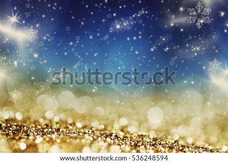 blurred bokeh of Christmas lights. Magic holiday abstract glitter background with blinking stars and falling snowflakes.