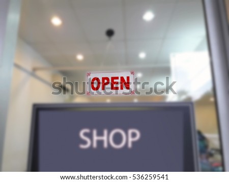 Open sign on a glass door