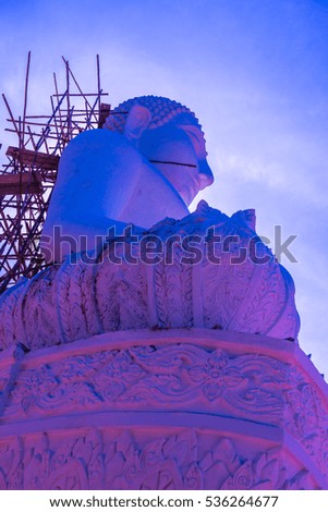 White buddha statue under construction at Phra That Maeyen temple, Thailand.