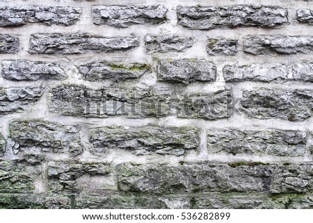 White brick masonry in the old city wall - texture Middle Ages