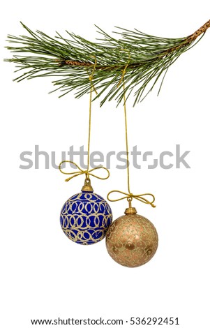 Beautiful Christmas balls hanging on branch of the pine, isolated on a white background