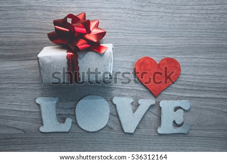 LOVE letters, cardboard heart and gift  box  with red bow. concept for Valentine's day, romantic anniversary,love.