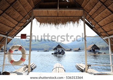 Cottage on bamboo rafts in the reservoir.