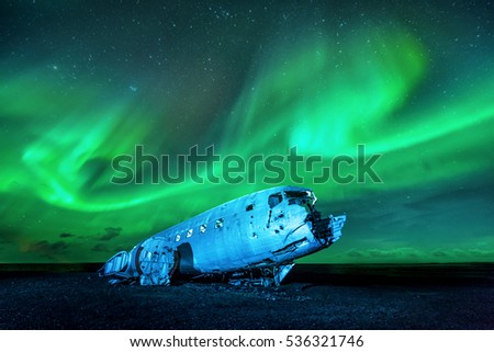 Wreck of a US military plane crashed in the middle of the nowhere. The plane ran out of fuel and crashed in a desert not far from Vik, South Iceland in 1973. The crew survived. Royalty-Free Stock Photo #536321746