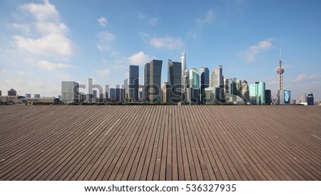 Empty wood floor with modern city landmark buildings of Shanghai bund Skyline 