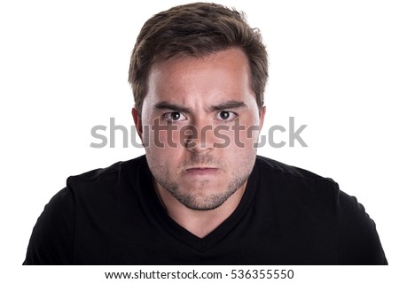 Face of an angry and furious male on a white background.  The image is depicting emotions of anger and frustration. Royalty-Free Stock Photo #536355550