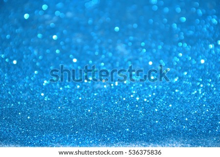 glitter vintage lights background. black, silver and blue. defocused