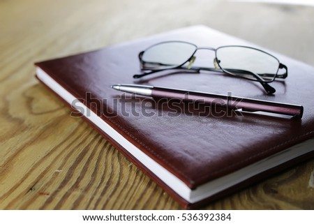 pen business wallet glasses notebook