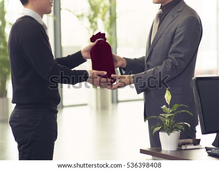 Agent giving customer a premium gift 