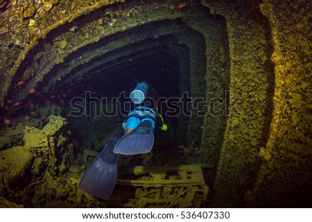 Diver on British military transport ship sunk during World War II Royalty-Free Stock Photo #536407330