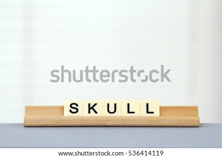 letters spelling Skull
