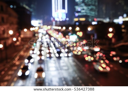 Artistic style - Defocused urban abstract texture bokeh city lights & traffic jams in the background with blurring lights.
