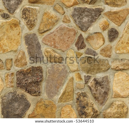 Seamless masonry wall with irregular shaped stones