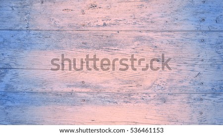 Old wooden wall in pink rose quartz and blue serenity colors, detailed background photo texture. Natural wooden building structure background. Plank fence close up.