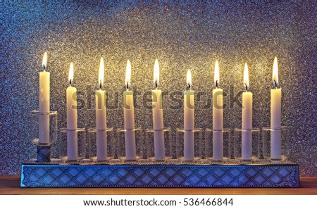 Menorah is a major traditional Jewish symbol for Hanukkah holiday. Image toned for inspiration of vintage style and festive mood