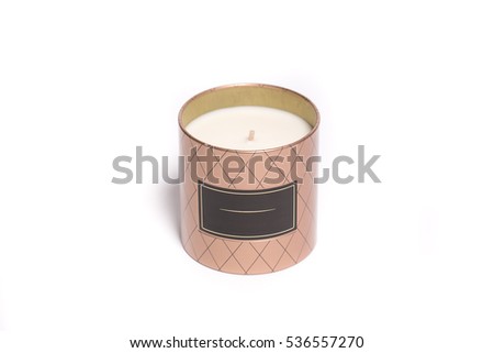 Cream candle in gift metal brown box with a tag isolated on white background