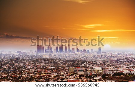 shining sun over Los Angeles at sunset, California
