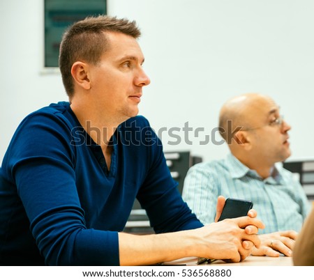 Businessmen In A Meeting Listening