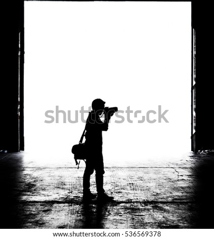 Silhouette of a photographer man