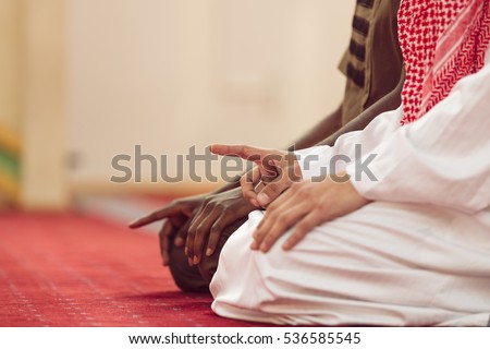 Two religious muslim man praying together inside the mosque Royalty-Free Stock Photo #536585545