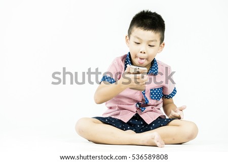 boy playing in a mobile phone on an isolated white background