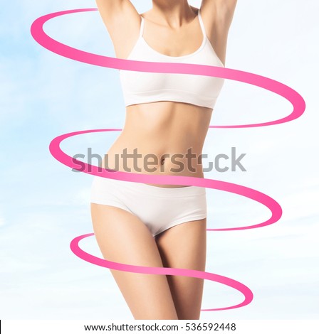 Close-up of thin and beautiful female body. Weight loss, fat burn, sports, exercising concept. Red arrows.