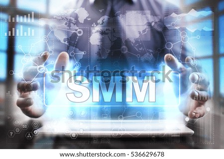 Businessman using tablet pc and selecting smm.