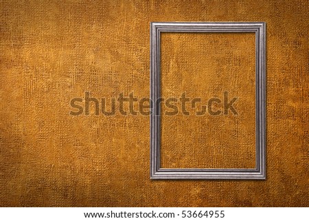 Silver frame on a yellow wall background
