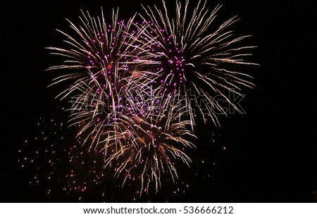 Fireworks light up the sky with dazzling display celebration  New years eve congratulations firework event  stock, photo, photograph, picture, image