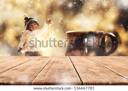 Empty tabletop with blurry little boy christmas toy decoration with snow stardust magical glitter merry xmas for product display or montage your job editing.