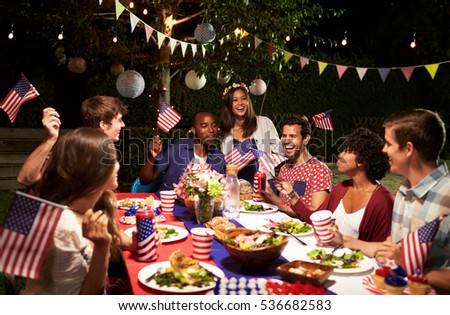 Friends Celebrating 4th Of July Holiday With Backyard Party Royalty-Free Stock Photo #536682583