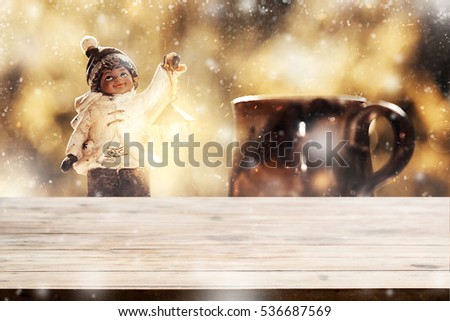 Empty tabletop with blurry little boy christmas toy decoration with snow stardust magical glitter merry xmas for product display or montage your job editing.